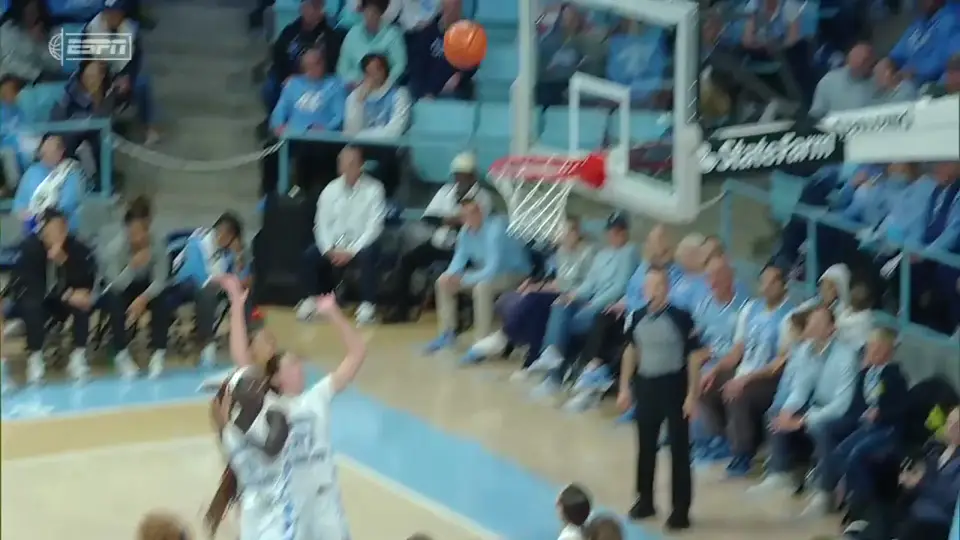 Hannah Hidalgo finishing an up-and-under layup at the rim against North Carolina